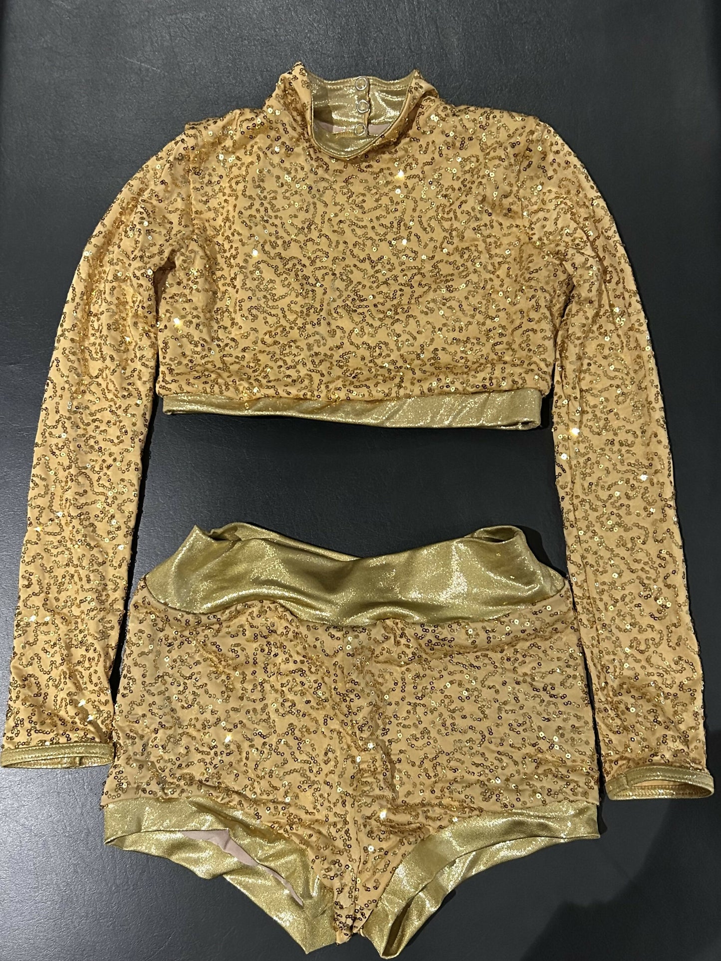 Gold two piece jazz costume with sequins